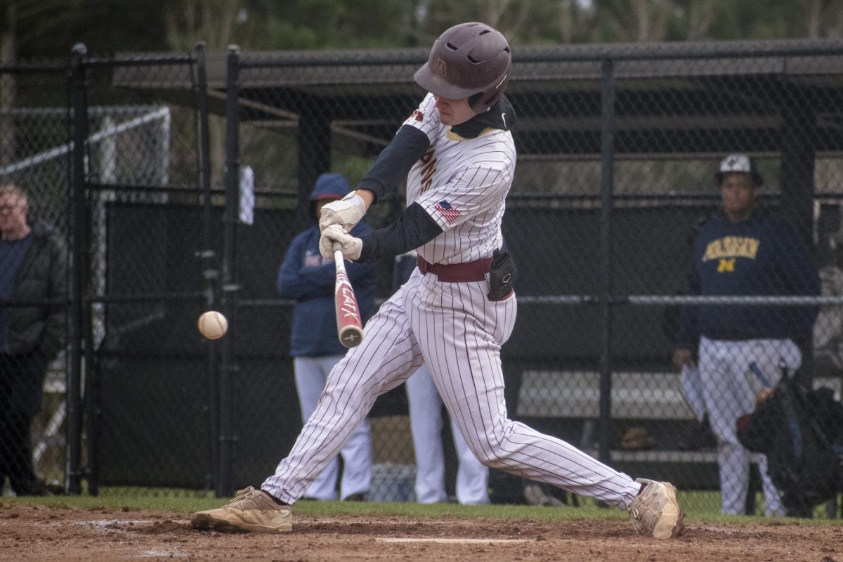 Senior Michael Chiocco hits against Westborough during Algonquin's winning game on April 11.