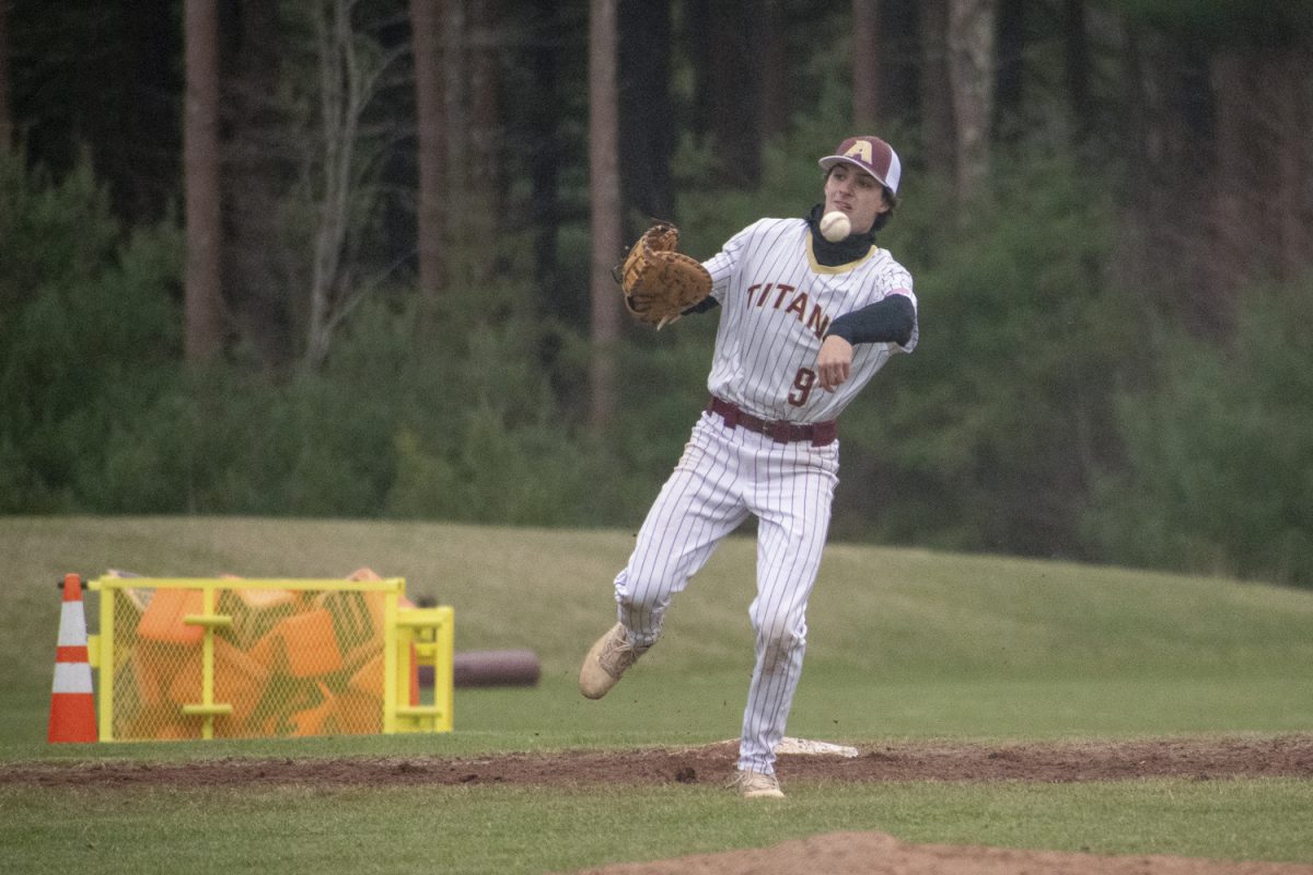 Senior Michael Chiocco throws the ball to his teammate during their game against Westborough on April 11. Algonquin won 3-1 against Westborough.