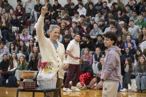 During the second annual rock, paper, scissors championship on April 11, senior Olivia Dornelas loses against Principal Sean Bevan in the end after winning against her classmates. 