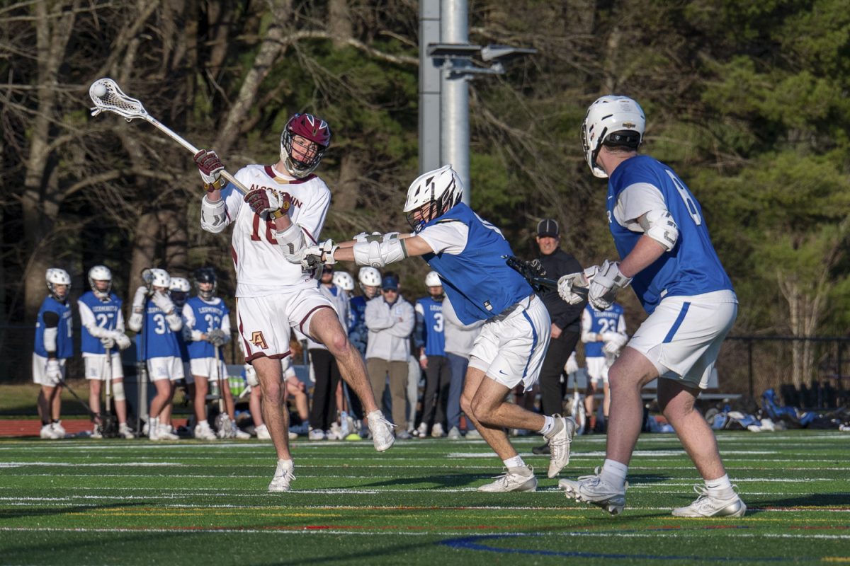 Junior Nick Robbins steps into the air to pass to a teammate during Algonquin's 7-1 winning game against Leominster.