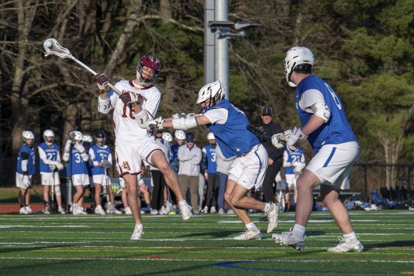 Junior Nick Robbins steps into the air to pass to a teammate during Algonquin's 7-1 winning game against Leominster.