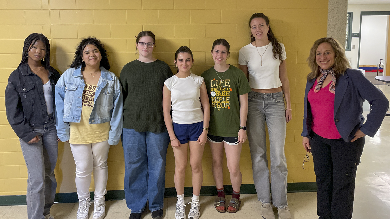 French exchange student Nelly Yemonohin, senior Sarah De Oliveria, junior Liah Biran, french student Romy Nicholas, junior Laura White, french student Louise Blanchy and Madame Lauren Osepchuk pose for a photo together.