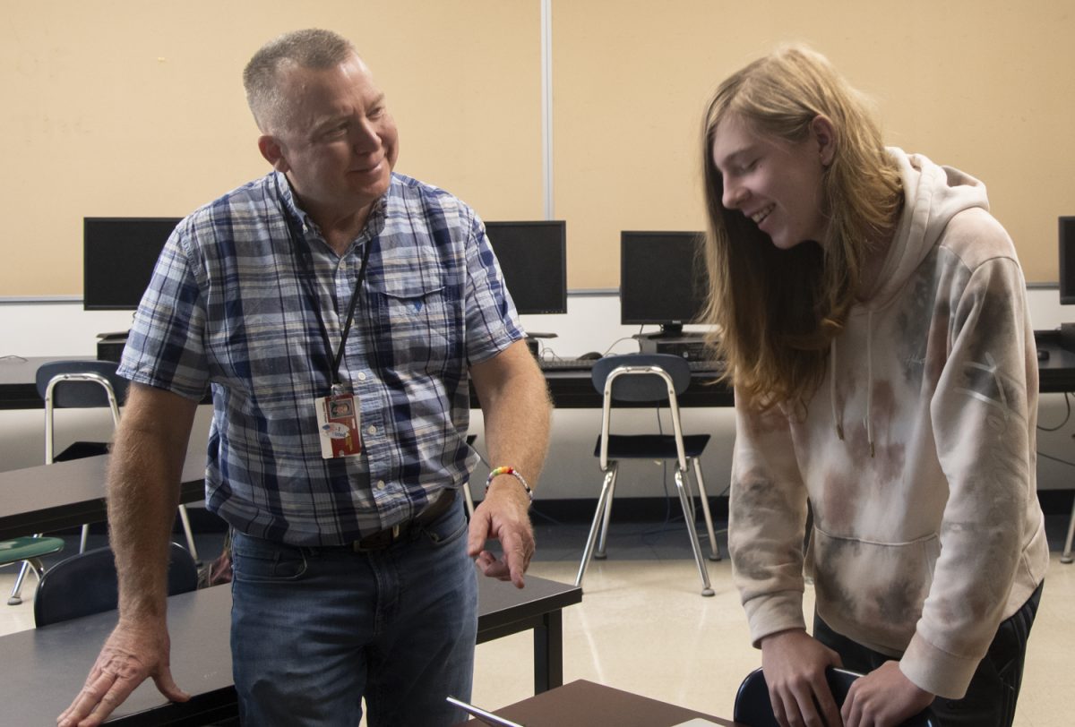 Computer teacher Dan Forhan and sophomore Calvin Midgley talk about Midgley’s new code at the Programming Club meeting. Forhan, the club’s advisor, held their last meeting on May 15 before his retirement at the end of the year.