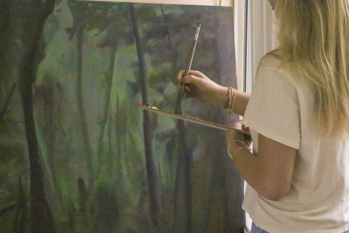 In her mural, senior Emma Burns uses overlooked art techniques she learned through studying Latin American art and artists.