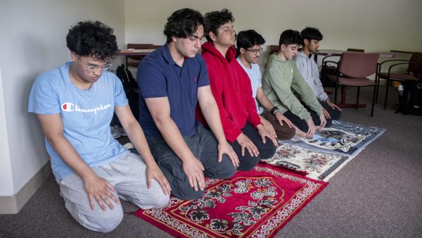 The Muslim Student Association prays before discussing Carnival plans on May 16. The MSA meets every Friday in room D110G in the library.