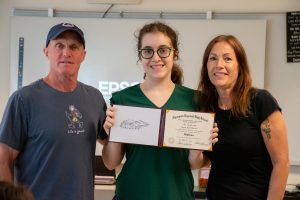 Postgraduate Brooke Harrison stands with her parents after being given her diploma signifying her graduation from Algonquin’s Community Access Program (CAP).