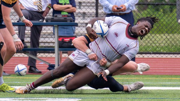 During Algonquin's game against Hanover, a Hanover opponent tackles junior Preston Biamou, hurting Biamou's leg. Algonquin lost 64-5 against Hanover on June 6 in the state semifinals.