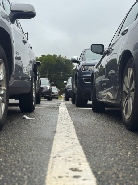 Students' cars line the Gold Lot on June 6, following the implementation of a new lottery-based parking system that assigns spaces to student drivers based on randomized selection. In previous years, students would camp out in the lot to claim their preferred spots.