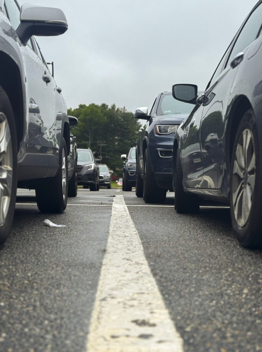 Students' cars line the Gold Lot on June 6, following the implementation of a new lottery-based parking system that assigns spaces to student drivers based on randomized selection. In previous years, students would camp out in the lot to claim their preferred spots.