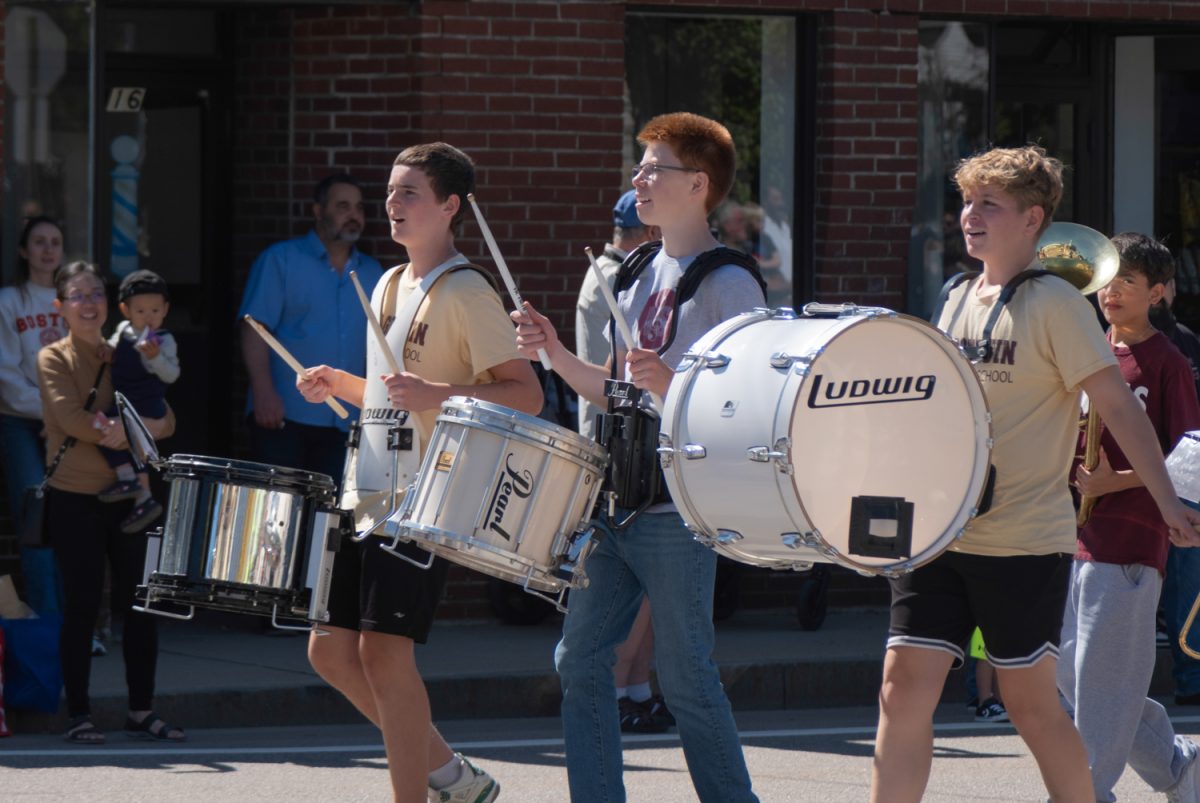 Freshman Connor Phaneuf, sophomore Ian Tregger and freshman Shea Rutledge perform with the Algonquin marching band during the 35th annual Applefest parade in downtown Northborough on Sept. 20.