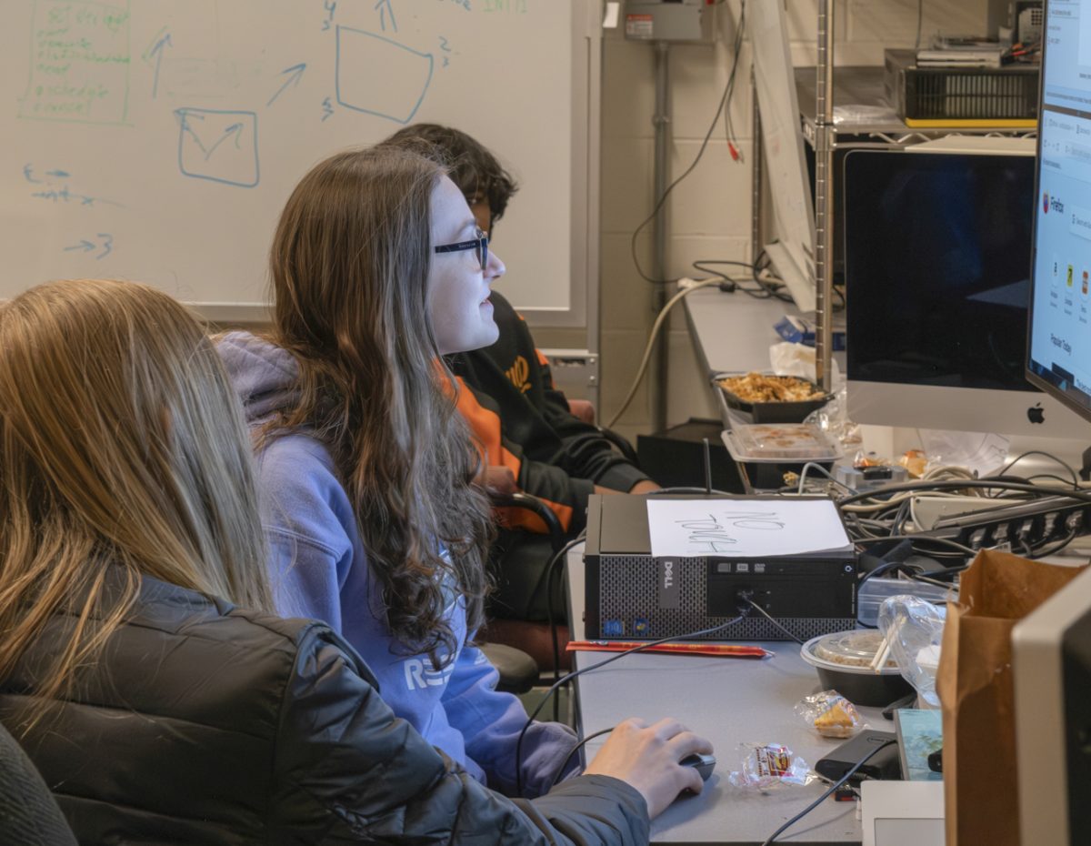 At the biweekly meeting of the Robotics club on Nov. 12, junior Caitiln Palmer works on computer work with her fellow team members.