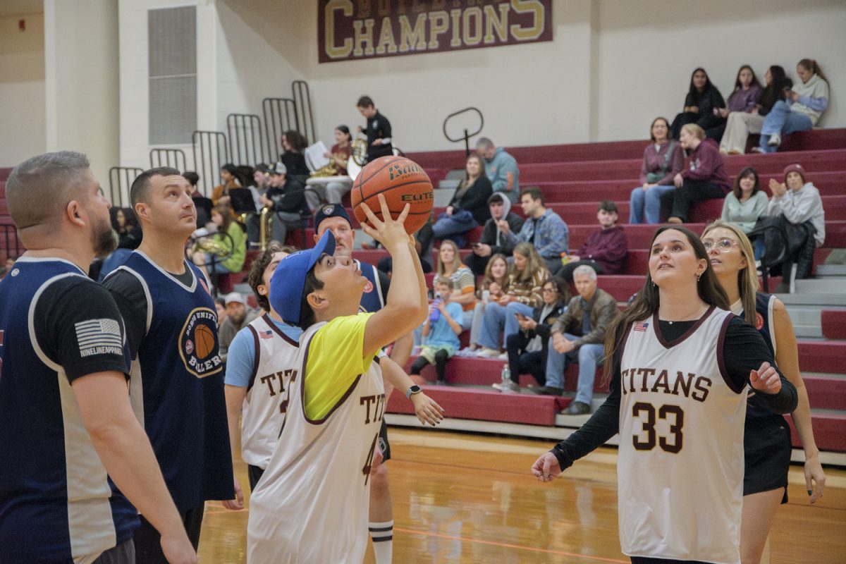 At the Boros Unified Basketball Game against Northborough and Southborough police, freshman Lucas Pingitore prepares to shoot.