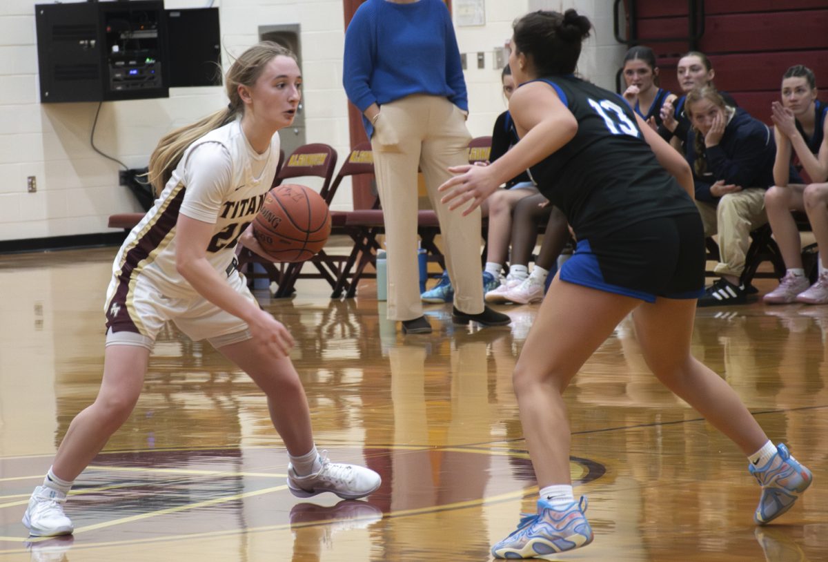 Senior Ashlee Dameri keeps possession of the ball while trying to dodge the opponents' defense.