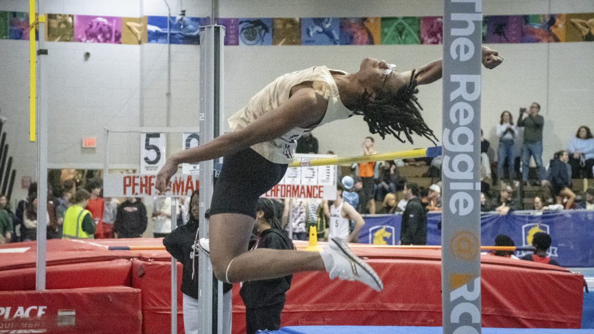 Senior Brandon Charles clears the bar during high jump at the Division 2 MSTCA Kalperis Relays meet at the Reggie Lewis Track and Athletic Center in Boston on Dec. 18. Charles jumped 1.78 meters, pulling the boys high jump relay team into second place with a combined result of 5.19 meters.