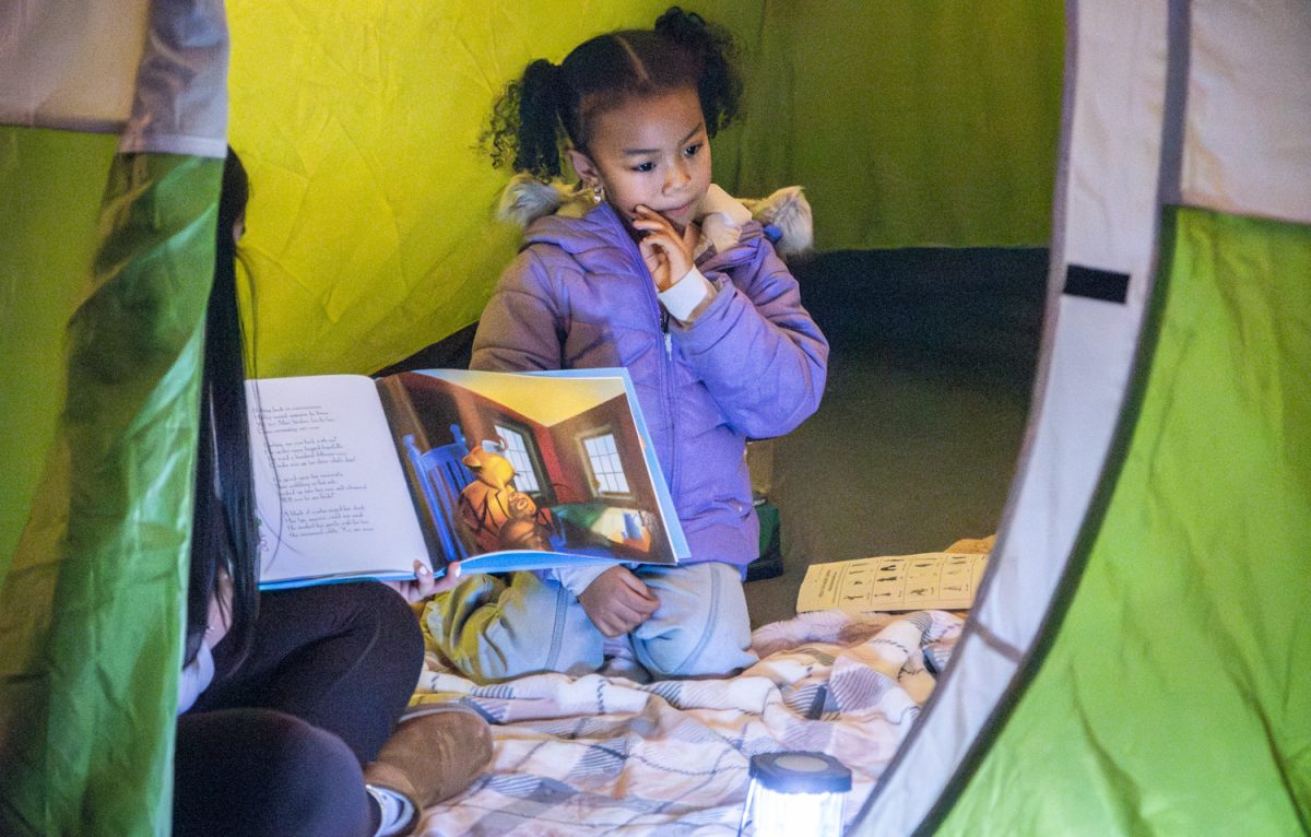 Student volunteers and attendees gather at the “Reading Under the Stars” station during the NSBoro Reads event on Feb. 3.