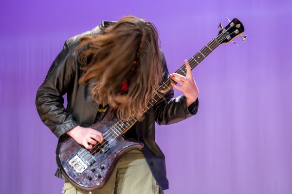 Senior Ian Somers plays “My Own Summer (Shove It)” by Deftones on bass guitar along with his band at Algonquin's Got Talent on Jan. 4.