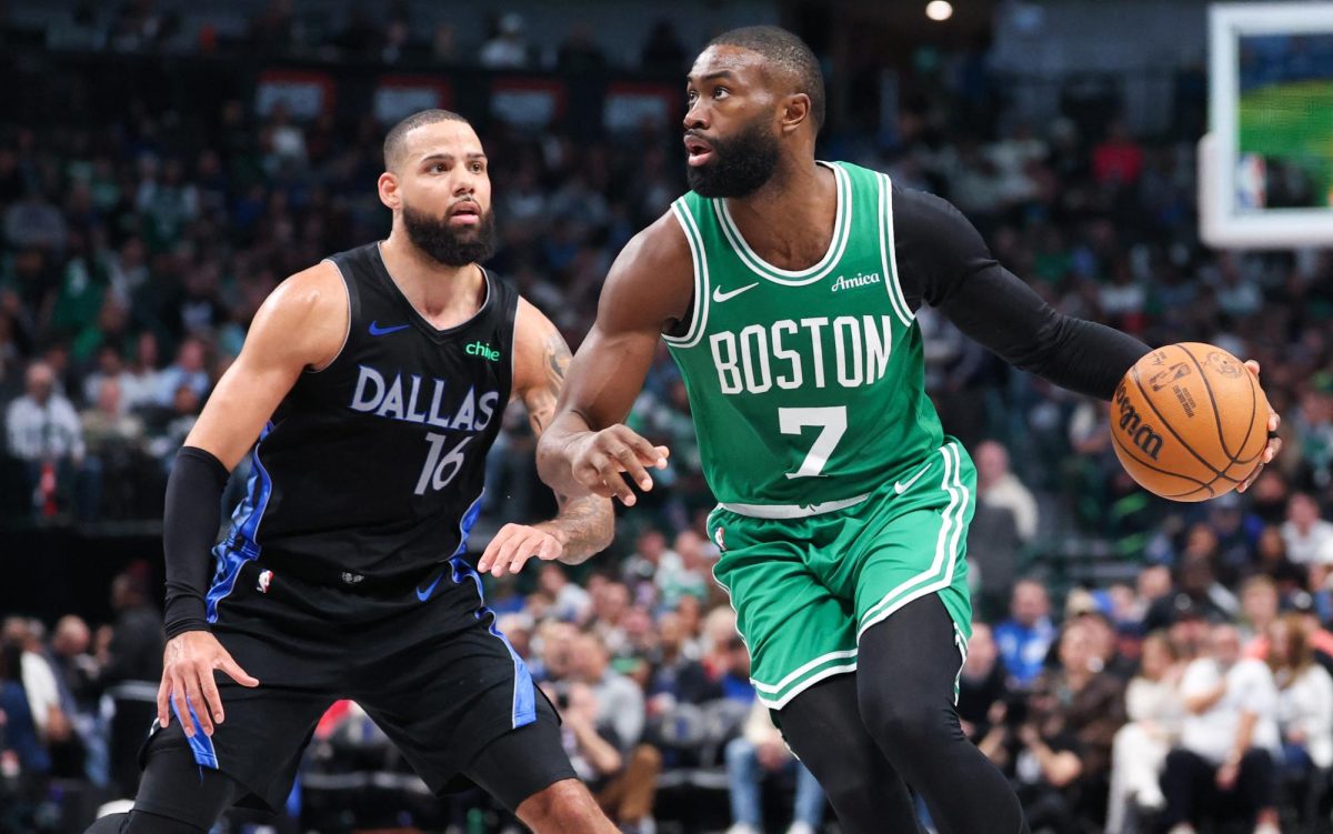 Feb 3, 2026; Dallas, Texas, USA;  Boston Celtics guard Jaylen Brown (7) controls the ball as Dallas Mavericks forward Caleb Martin (16) defends during the second half at American Airlines Center. Mandatory Credit: Kevin Jairaj-Imagn Images