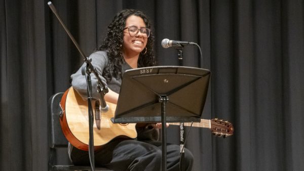 Sophomore Nathalia Souza smiles at the end of her performance of "From the Start" by Laufey during Algonquin's Got Talent on Feb. 4.