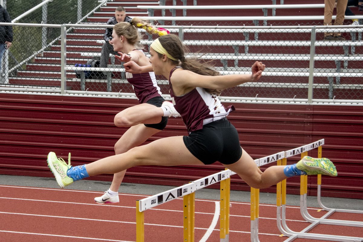 During the first heat of the 100-meter hurdles race, freshman Charlotte Lipka runs 17.57 seconds, placing 3rd overall during the girls' track meet on May 13. Lipka scored six of Algonquin’s 78 points in the team’s win against Shrewsbury.