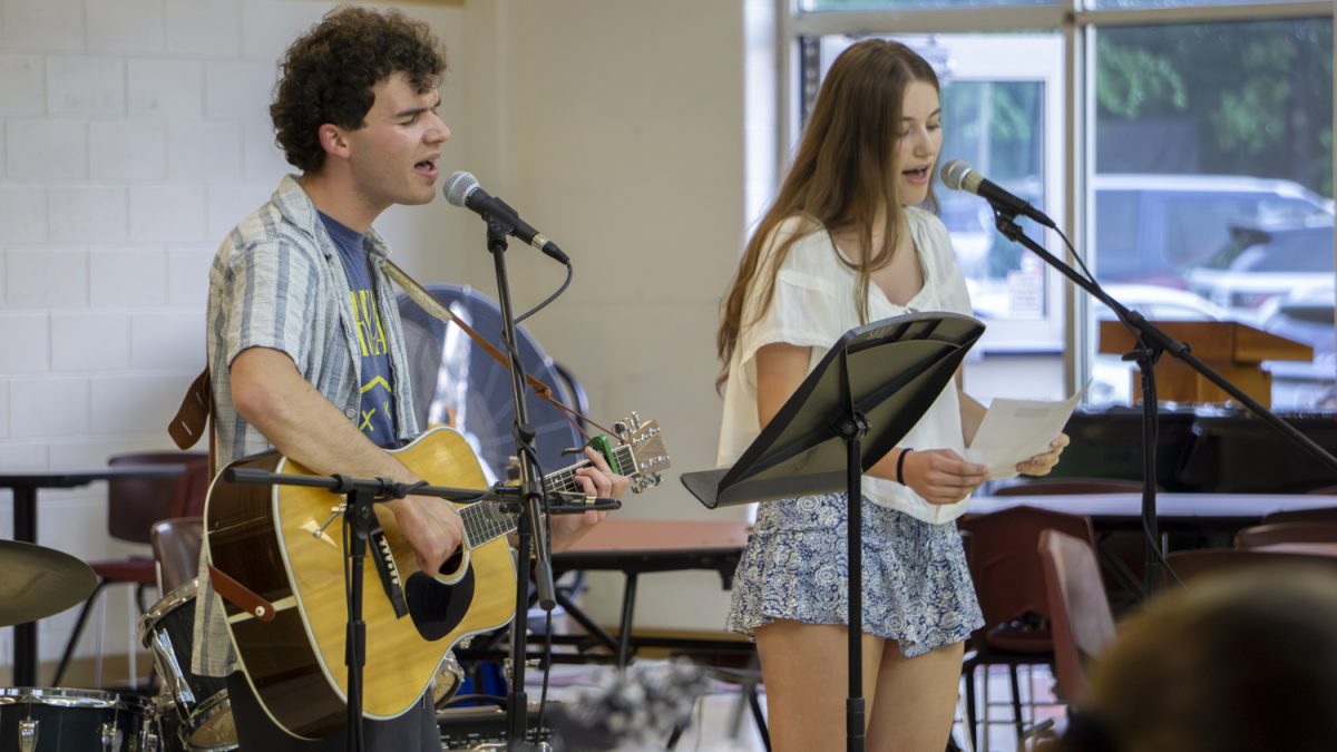 Seniors Danny Schanzer and Arabella Parry-George perform "The Last Time" by Taylor Swift during the Tri-M Coffeehouse on May 19.