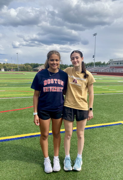 Sophomores Josephine “JoJo” Cesar and Josephine “JoJo” Gugger pose at the Algonquin athletic fields. 